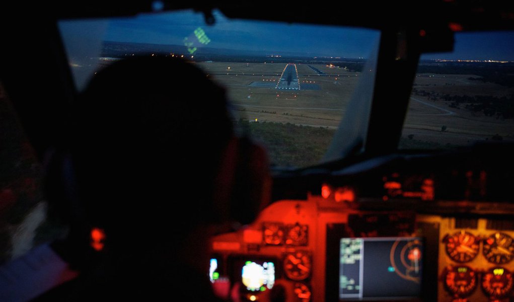 Co-Pilot, Flying Officer Marc Smith, flies his Royal Australian Air Force (RAAF) AP-3C Orion aircraft towards the runway at RAAF Pearce Base in Bullsbrook near Perth March 24, 2014, after searching for the missing Malaysian Airlines Flight MH370. An Austr