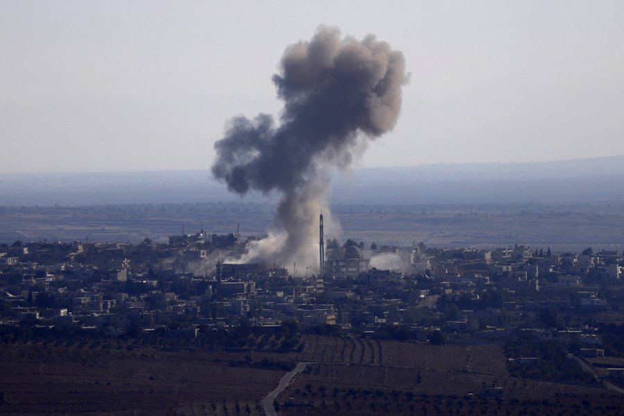 Smoke rises from the Syrian Syrian village of Jubata al-Khashab after it was bombed by a Syrian fighter jet on September 23, 2014, moments before the jet was shot down by the Israeli military over the Golan Heights. Israel shot down a Syrian fighter jet o