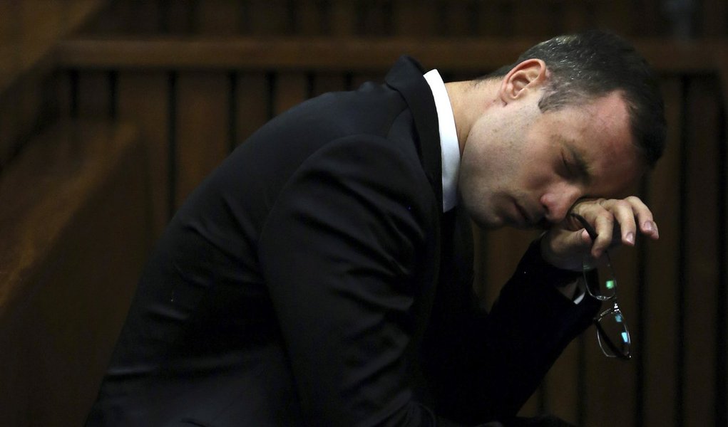 Oscar Pistorius attends his trial at the high court in Pretoria April 7, 2014. South African Olympic and Paralympic track star Pistorius took the witness stand in his own defence at his murder trial on Monday, saying the shooting of his girlfriend Reeva S