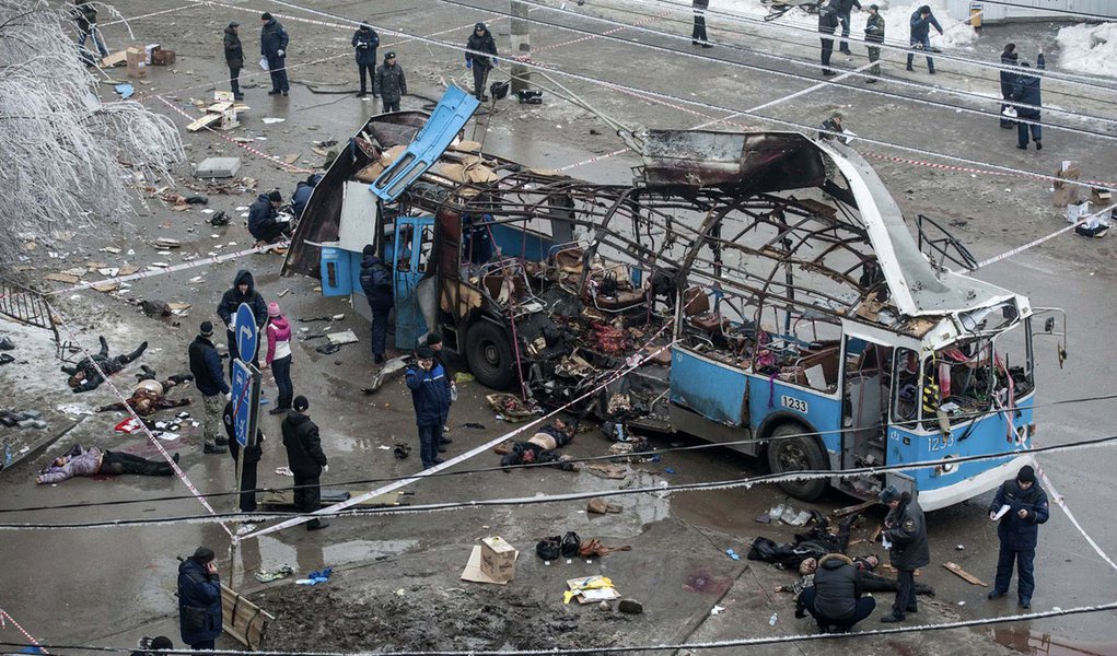 ATTENTION EDITORS - VISUAL COVERAGE OF SCENES OF INJURY OR DEATH

Investigators work at the site of a blast on a trolleybus in Volgograd December 30, 2013. A bomb blast ripped a trolleybus apart in Volgograd on Monday, killing 14 people in the second de