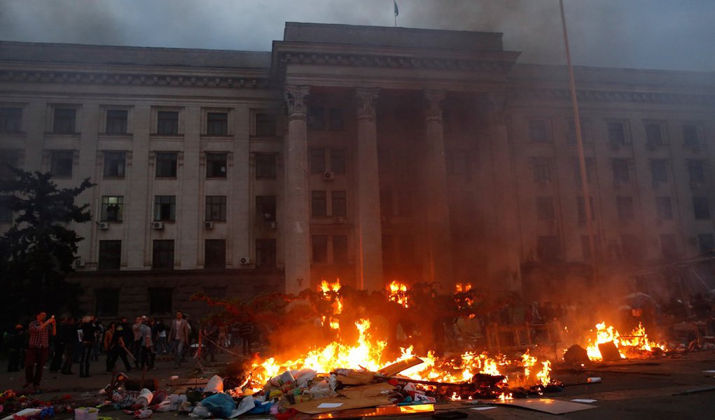 A pro-Russian activist tent camp burns in front of the trade union building in Odessa May 2, 2014. At least 38 people were killed in a fire on Friday in the trade union building in the centre of Ukraine's southern port city of Odessa, regional police said