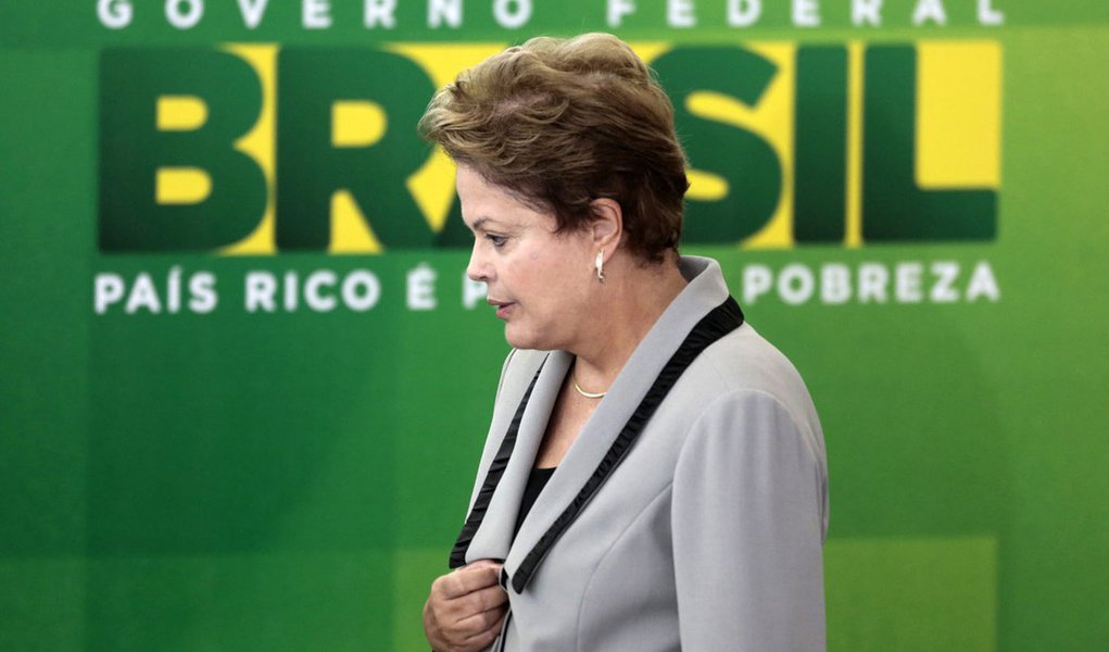 Brazil's President Dilma Rousseff reacts during an inauguration ceremony at the Planalto Palace in Brasilia April 1, 2014. Ricardo Berzoini of the ruling Workers' Party (PT) was inaugurated as Secretariat of the Institutional Relations Ministry, replacing