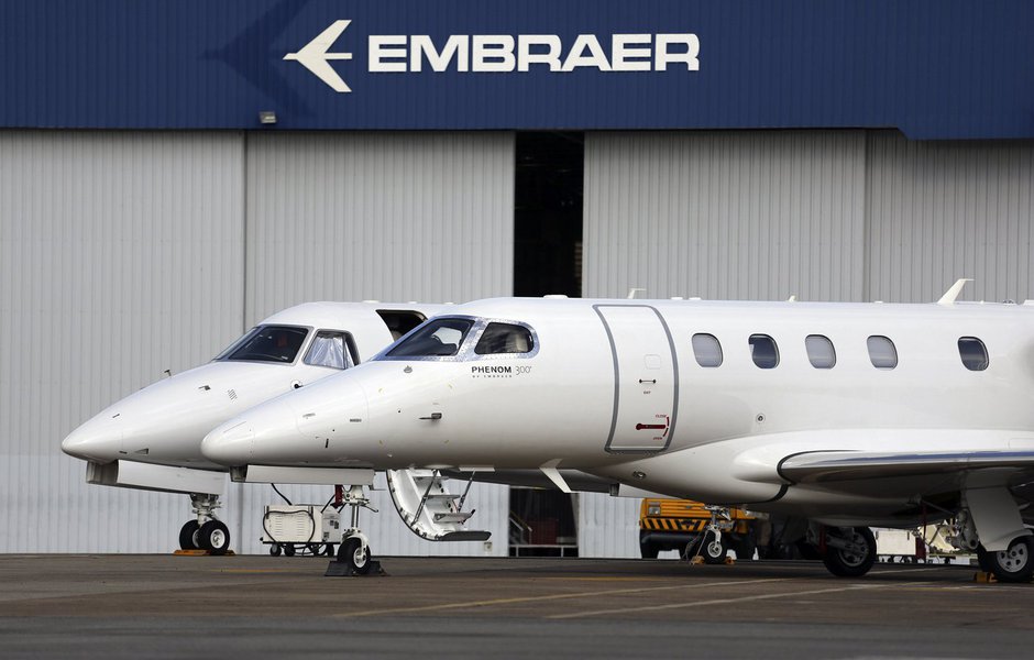 Private jets are seen at the Embraer headquarters in Sao Jose dos Campos, 100 km (62 miles) from Sao Paulo May 14, 2013. Brazil's barriers to international trade are limiting its growth potential and could hamper a huge infrastructure push at the center o