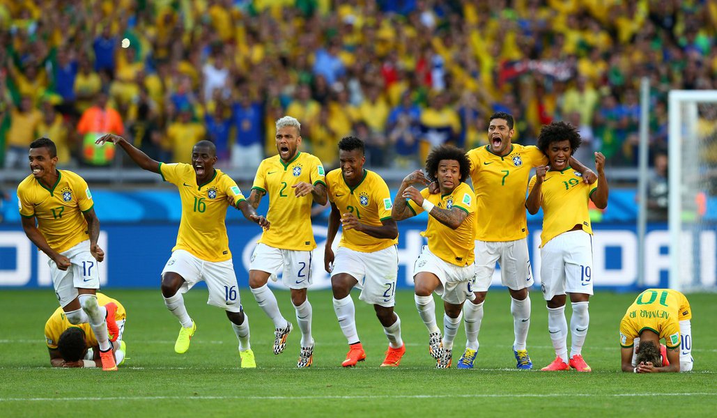 BELO HORIZONTE, BRAZIL - JUNE 28: (L-R) Thiago Silva, Luiz Gustavo, Ramires, Dani Alves, Jo, Marcelo, Hulk, Willian and Neymar of Brazil celebrate after defeating Chile in a penalty shootout during the 2014 FIFA World Cup Brazil round of 16 match between 