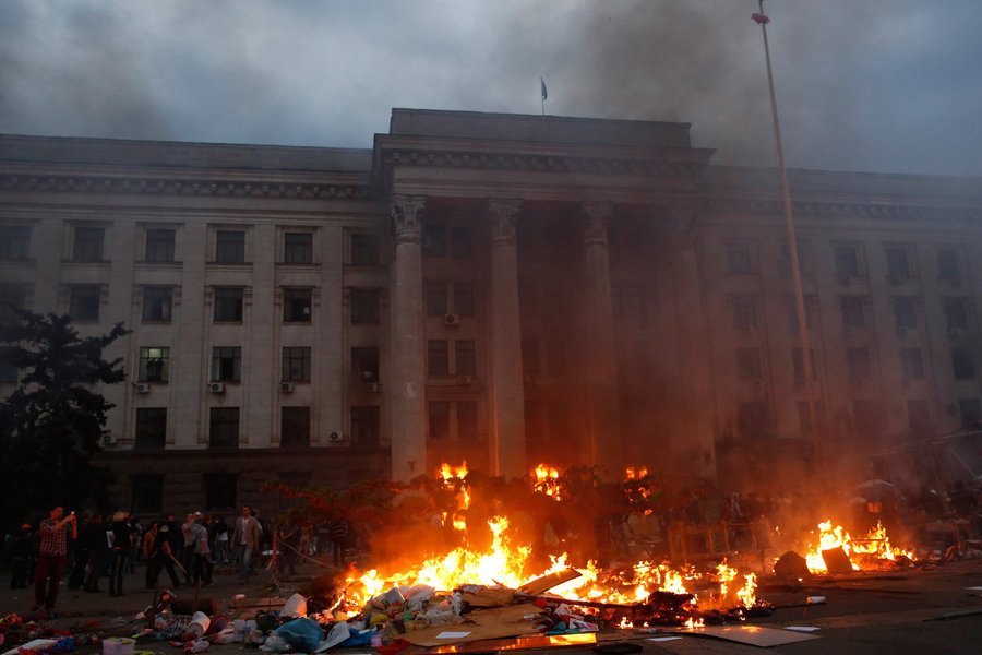 A pro-Russian activist tent camp burns in front of the trade union building in Odessa May 2, 2014. At least 38 people were killed in a fire on Friday in the trade union building in the centre of Ukraine's southern port city of Odessa, regional police said
