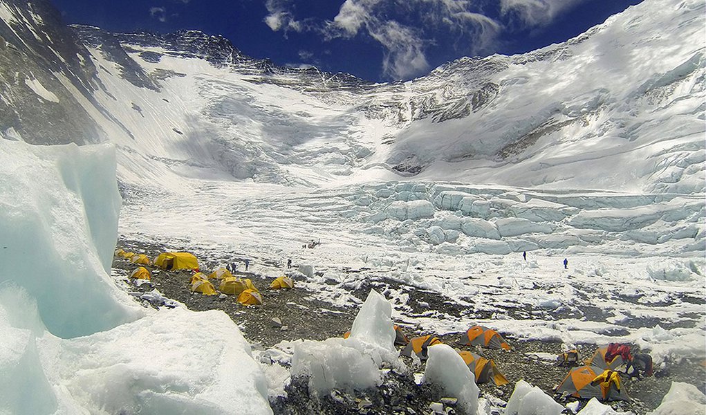 In this Tuesday, May 16, 2013 photo, tents are pitched on Camp 2, as climbers rest on their way to summit the 8,850-meter (29,035-foot) Mount Everest. May is the most popular month for Everest climbs because of more favorable weather. Earlier this month, 