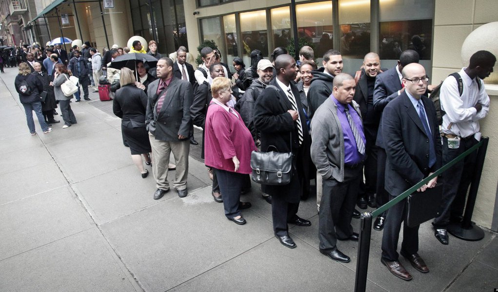 In this Wednesday, Oct. 24, 2012, photo, job seekers wait in line to see employers at a National Career Fairs' job fair in New York. Unemployment rates declined in October in more than half of the 372 largest U.S. cities, further evidence of steady improv