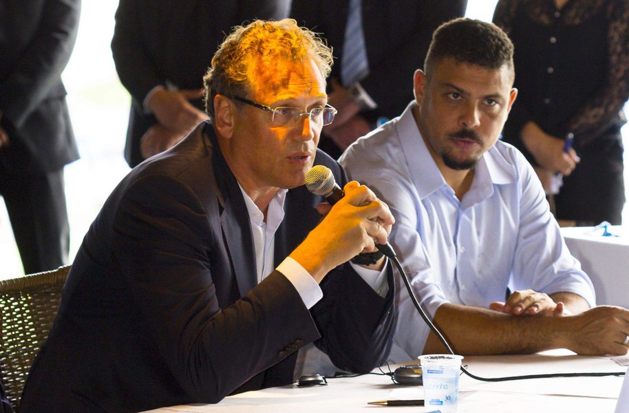 FIFA Secretary General Jerome Valcke (L) speaks during a news conference next to Ronaldo, Brazil's former soccer player and member of the Local Organizing Committee for the 2014 World Cup, at the Arena Pantanal soccer stadium in Cuiaba April 23, 2014. Are