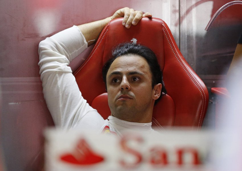 Ferrari Formula One driver Felipe Massa of Brazil rests in his garage during the third practice session of the Japanese F1 Grand Prix at the Suzuka circuit October 12, 2013.     REUTERS/Issei Kato (JAPAN  - Tags: SPORT MOTORSPORT F1)  