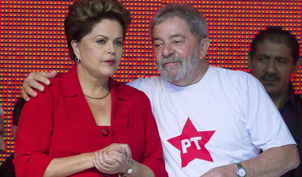 Brazil's President Dilma Rousseff (L) stands with her predecessor Luiz Inacio Lula da Silva at the national convention of their Workers' Party (PT) in Brasilia June 21, 2014. The party confirmed at the convention that Rousseff will be the candidate for re