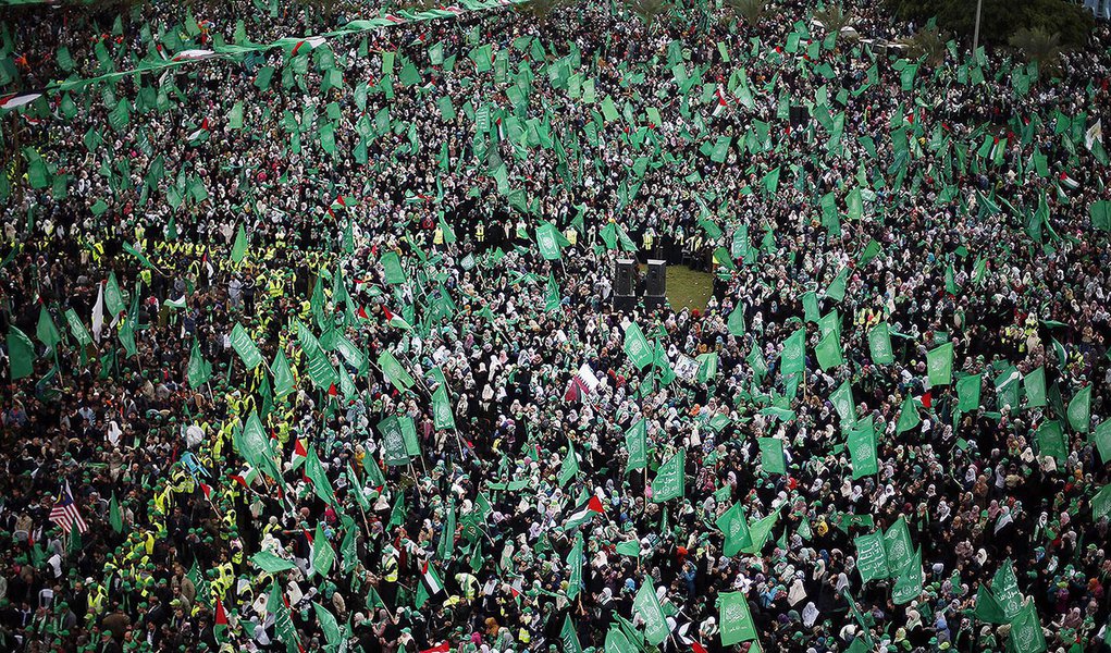 Palestinians take part in a rally marking the 25th anniversary of the founding of Hamas, in Gaza City December 8, 2012. After receiving a hero's welcome on his return from decades in exile, Hamas leader Khaled Meshaal will attend a rally in Gaza on Saturd