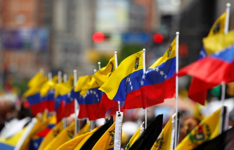 Venezuelan flags are seen during an opposition rally in Caracas, Venezuela, April 8, 2017. REUTERS/Christian Veron - RTX34Q8A