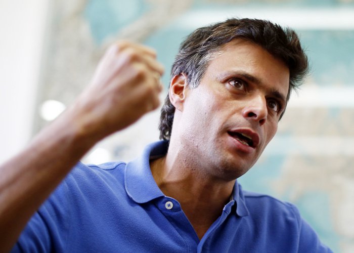 Venezuelan opposition leader Leopoldo Lopez gestures while speaking during an interview with Reuters in Caracas, February 11, 2014. Lopez says he is seeking to draw millions of Venezuelans into the streets to join protests decyring corruption, crime and s