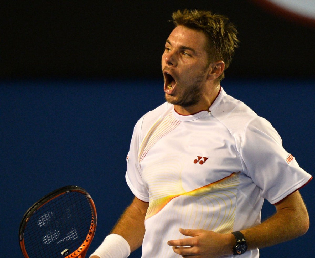 IMAGE RESTRICTED TO EDITORIAL USE - STRICTLY NO COMMERCIAL USE Stanislas Wawrinka of Switzerland celebrates beating Tomas Berdych of the Czech Republic in their men's singles match on day 11 of the 2014 Australian Open tennis tournament in Melbourne on Ja