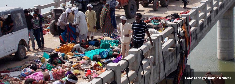 At least 89 killed in stampede at temple in India.