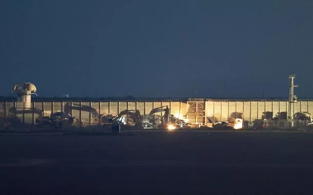 Military vehicles stand in position on the Israeli side of the Israel-Gaza border, July 3, 2025