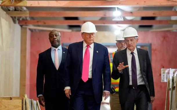 U.S. President Donald Trump, Federal Reserve Chair Jerome Powell, and U.S. Senator Tim Scott (R-SC) tour the Federal Reserve Board building, which is currently undergoing renovations, in Washington, D.C., U.S., July 24, 2025. 