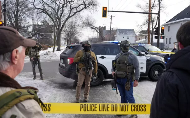 Members of U.S. Immigration and Customs Enforcement (ICE) stand at the scene after a driver of a vehicle was shot in Minneapolis, Minnesota, U.S., January 7, 2026.