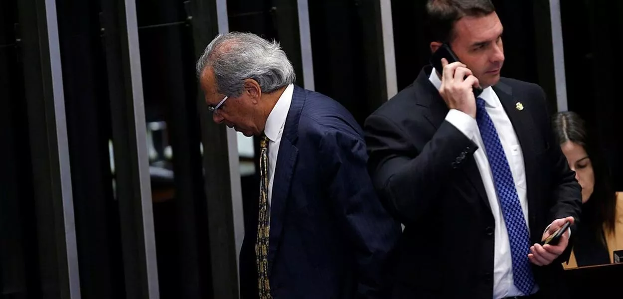 Paulo Guedes e Flávio Bolsonaro